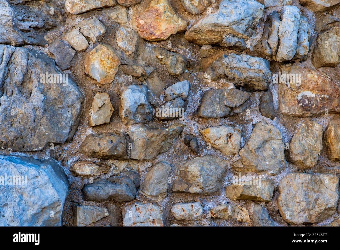 Rustic Stone Wall Background with Random Size Stones, Spain Stock Photo