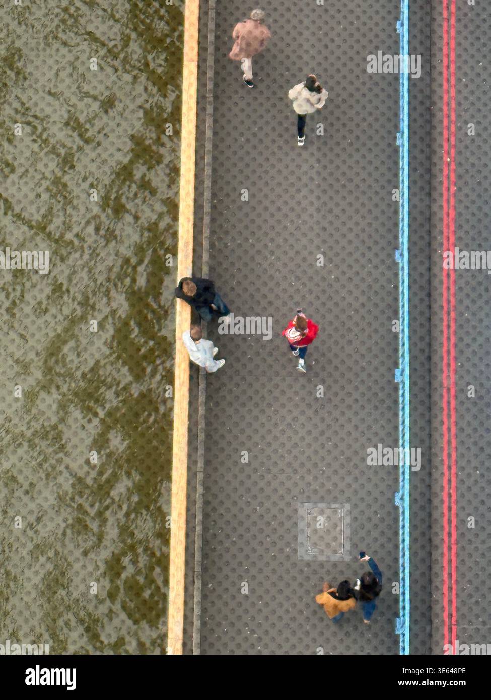 Aerial view of Thames river and pedestrian walkway from glass viewing platform of Tower Bridge, London. - Smartphone Captured Stock Image