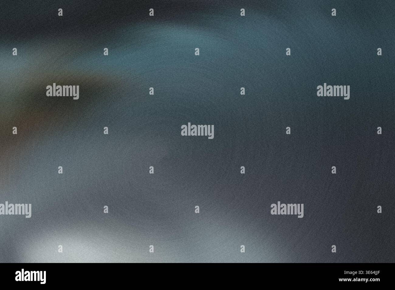 Blurry abstract image featuring shades of blue and gray in a gradient background with no distinct objects or features visible Stock Photo