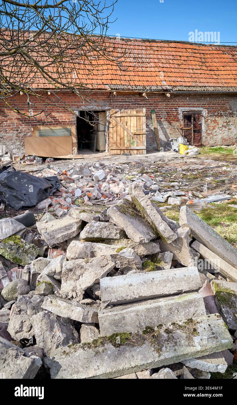 Demolition of an old building in the garden. Stock Photo