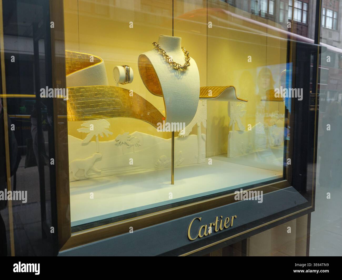 Cartier gold necklace displayed in shop window, London, UK Stock Photo