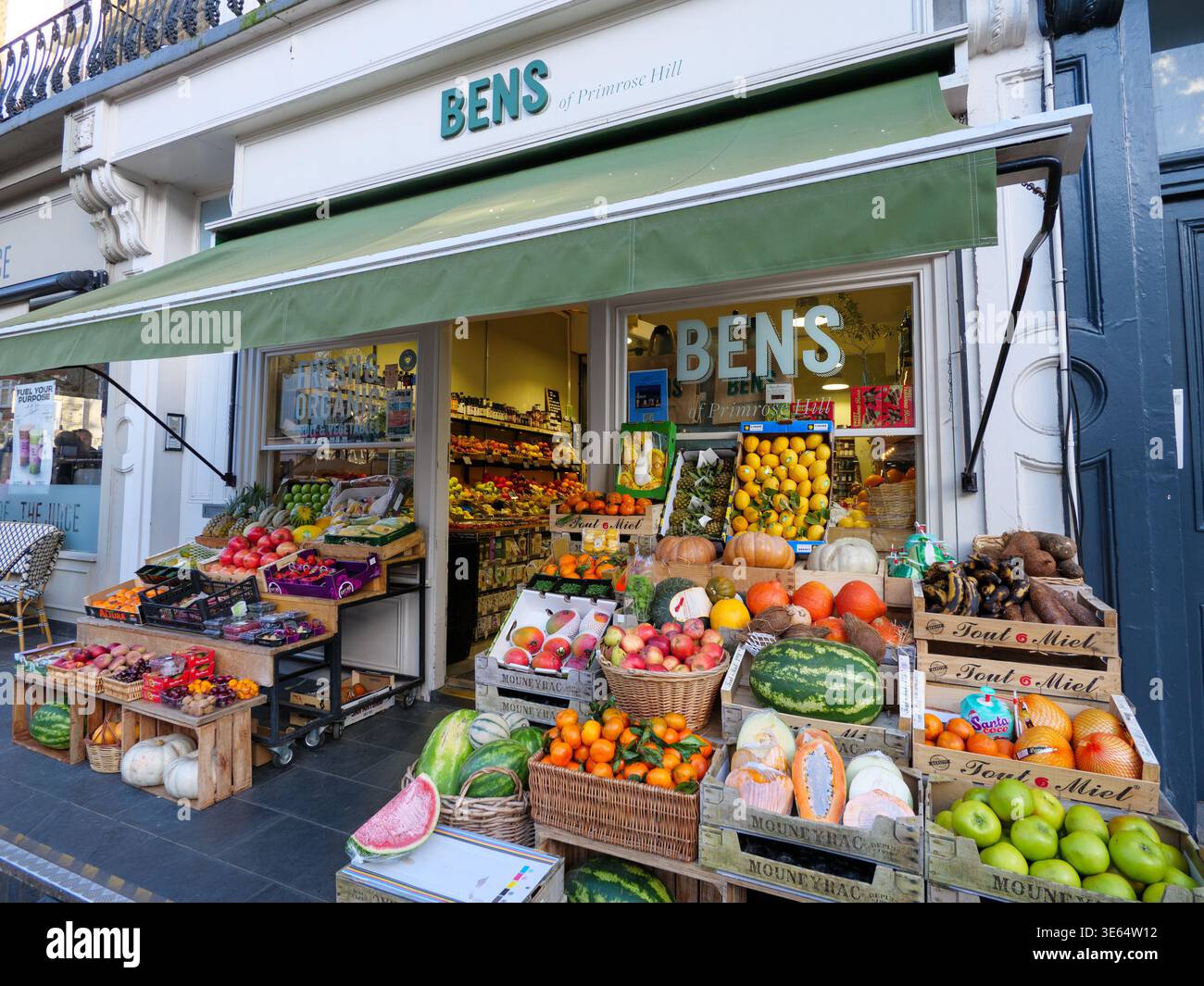 Fresh organic fruit and vegetables outside Bens healthy food shop, Primrose Hill, Camden, London, UK Stock Photo