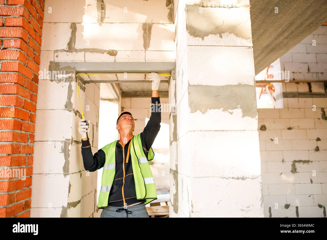 Action Ceiling Construction worker fits ceiling panels, attaches supports, technical ...