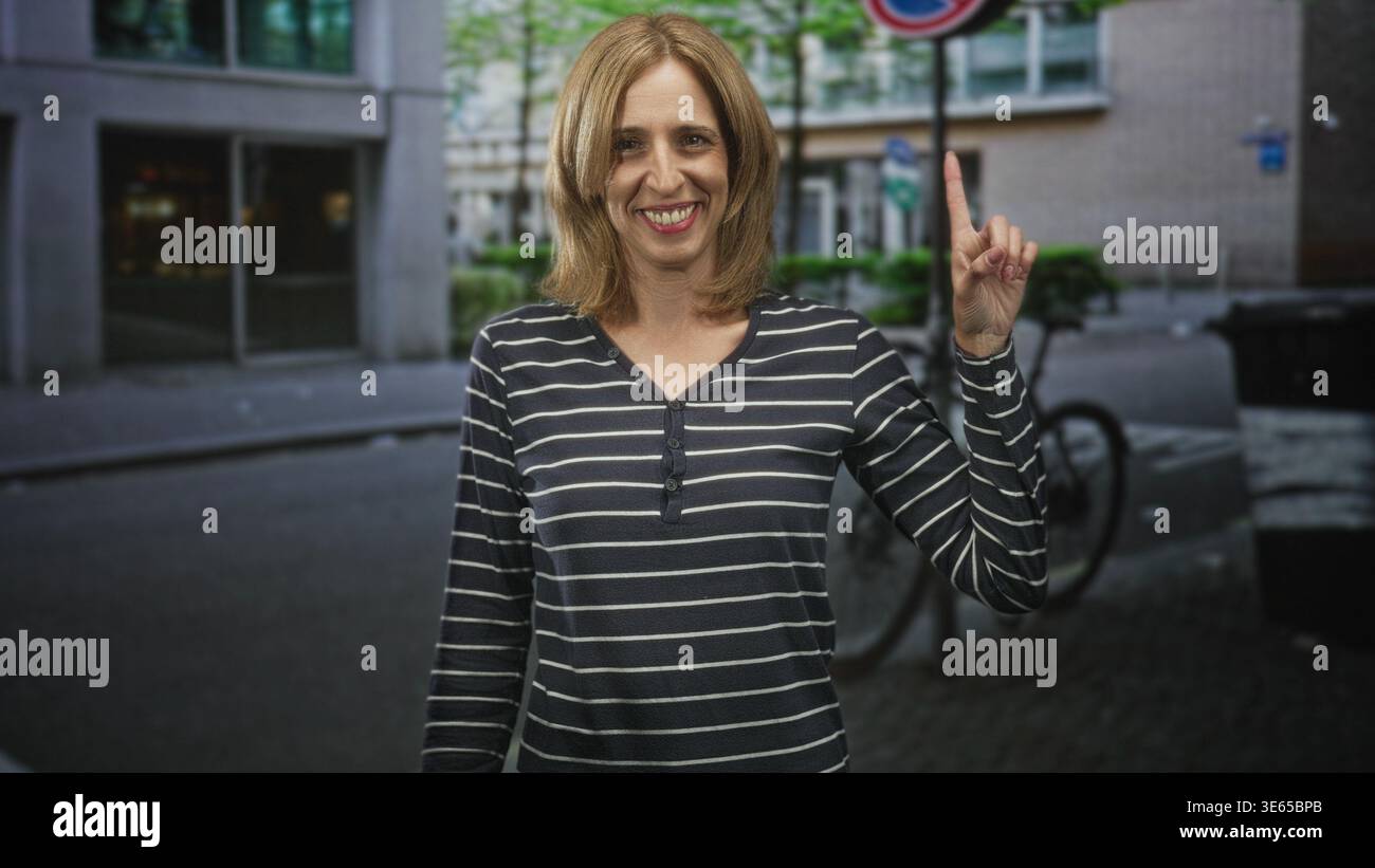 Woman points finger bike rack hi-res stock photography and images - Alamy