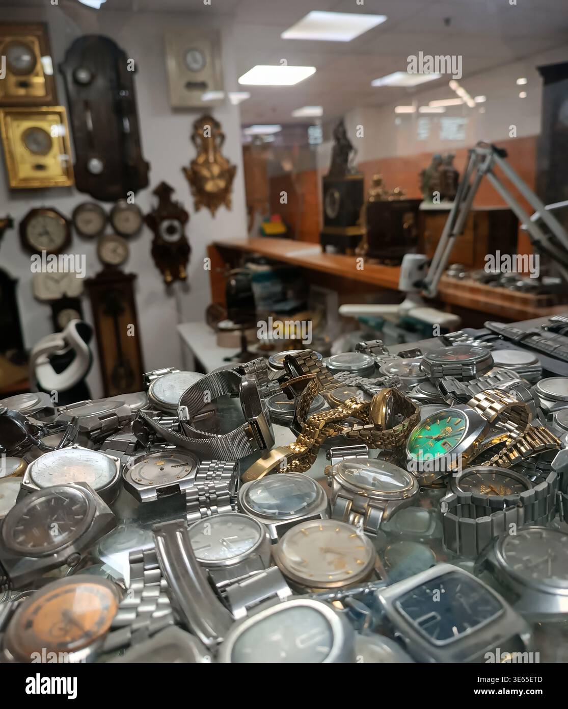 Description: Interior of an antique shop showing a glass display with ...