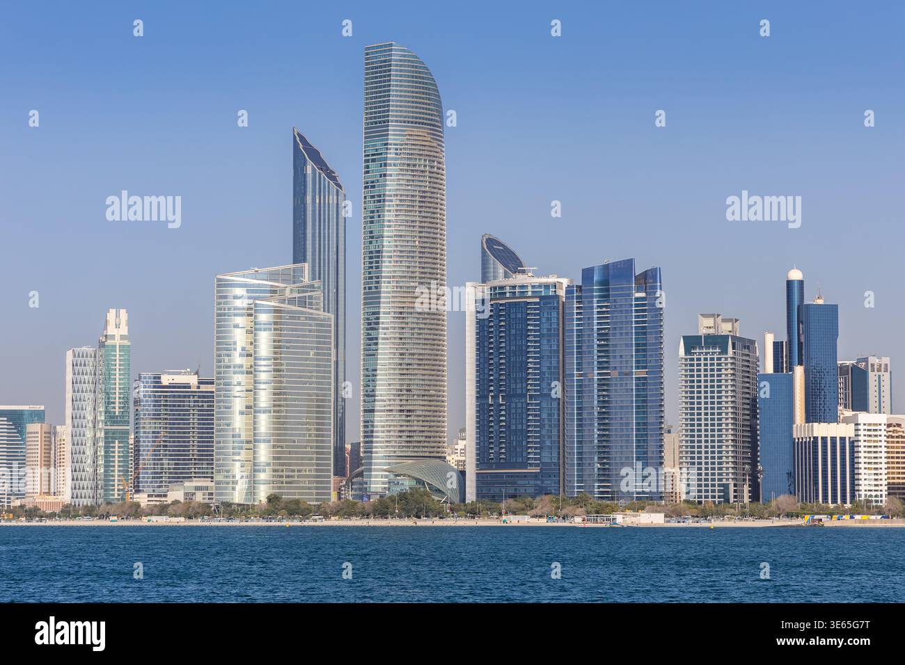 Abu Dhabi skyline with skyscrapers at sea traveling in Abu Dhabi, United Arab Emirates Stock Photo