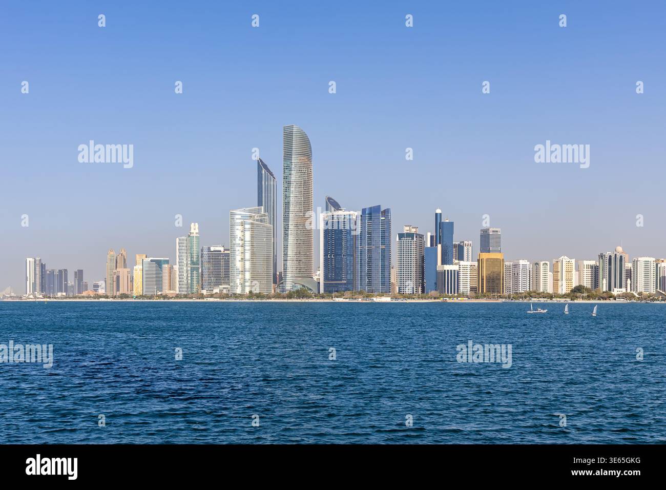 Abu Dhabi skyline with skyscrapers at sea traveling in Abu Dhabi, United Arab Emirates Stock Photo
