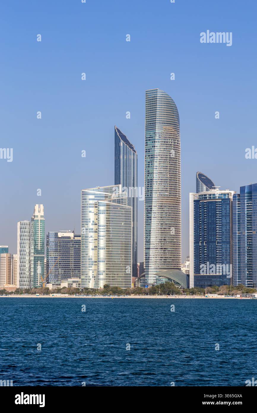 Abu Dhabi skyline with skyscrapers at sea traveling in Abu Dhabi, United Arab Emirates Stock Photo