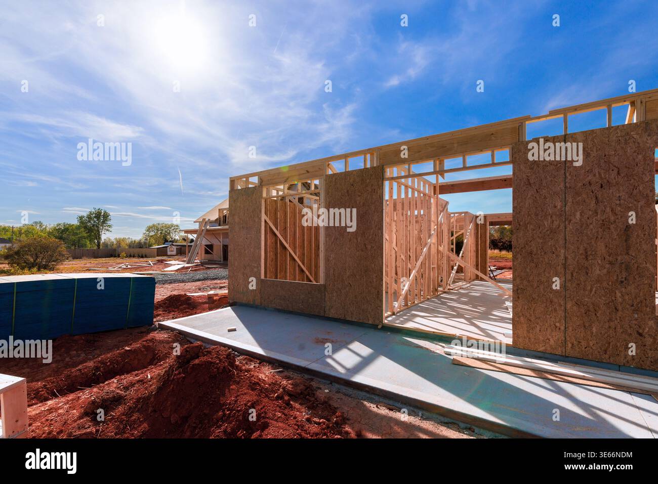 Workers are assembling wood frames for house at construction site on under framework progresses Stock Photo
