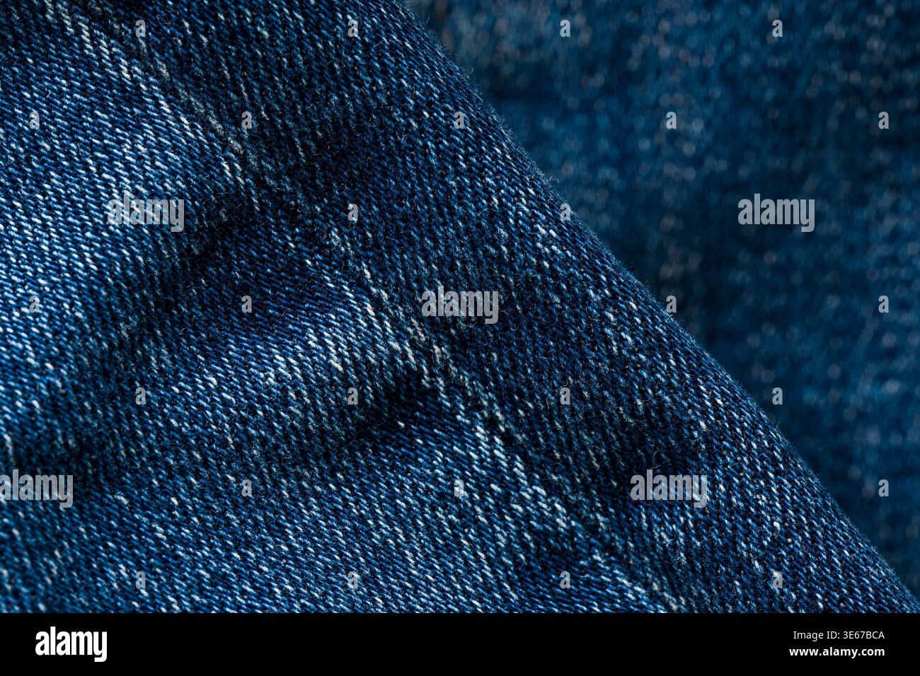 Detailed blue denim fabric texture background with visible stitching pattern Stock Photo