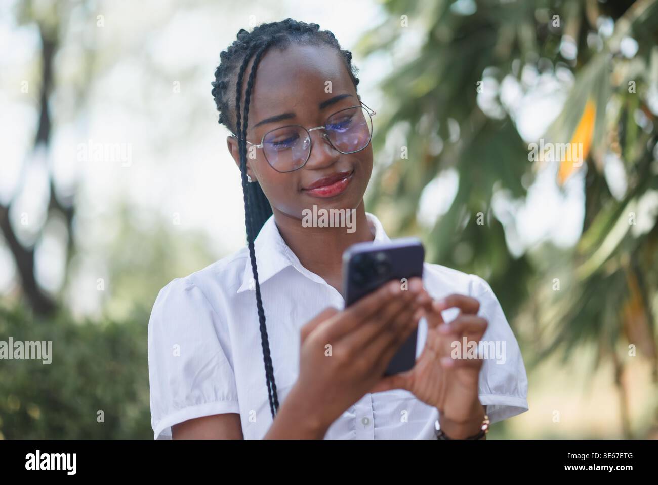 Woman wearing glasses braids hi-res stock photography and images - Alamy
