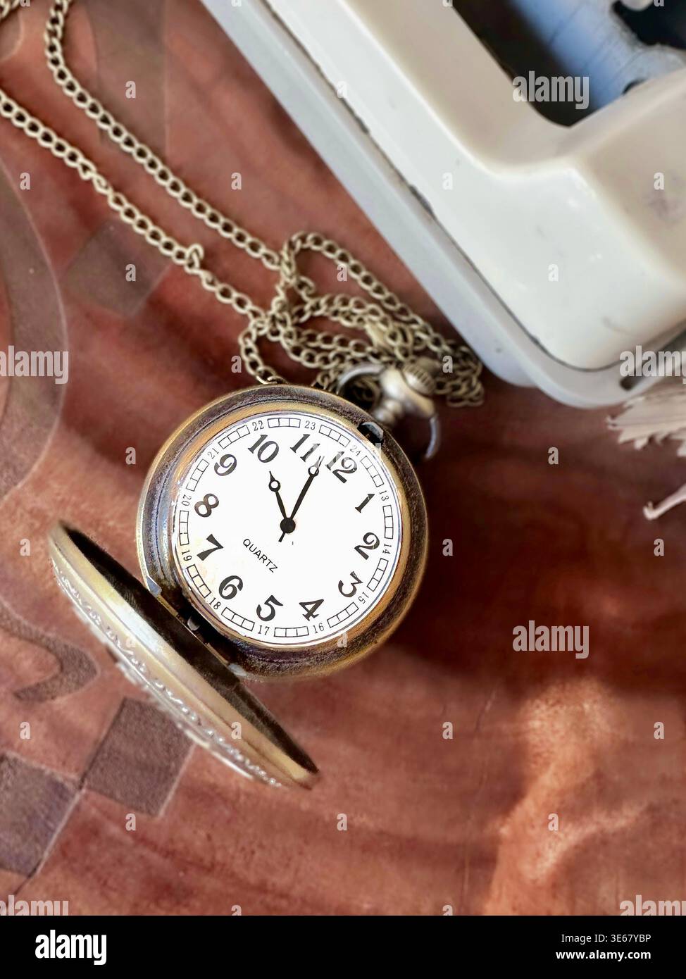 pocket watch on a desk Stock Photo