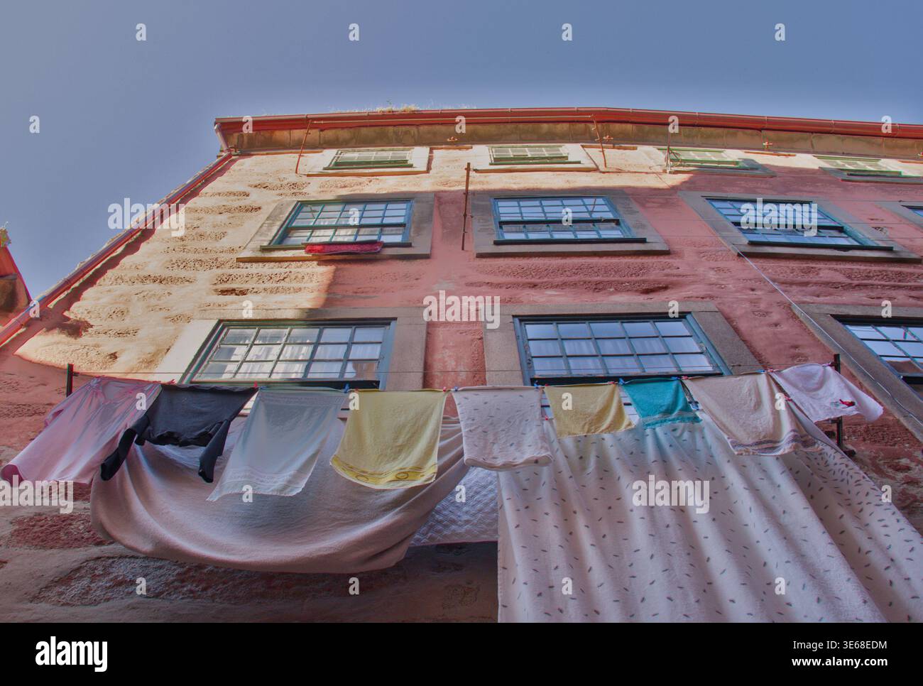 Hanging Laundry on Old Building Facade Stock Photo