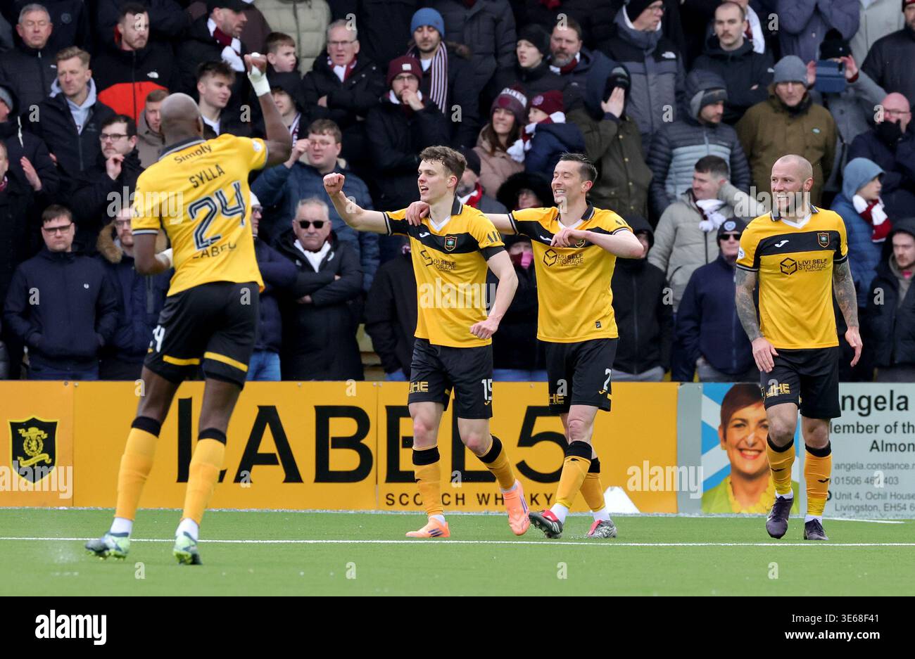 Livingston's Lewis Smith (second left) celebrates with his team mates ...