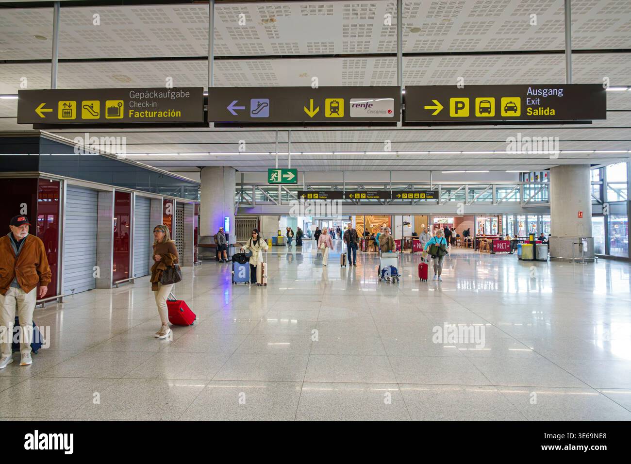 Malaga Spain,Andalusia,Malaga-Costa del Sol Airport Aeropuerto de AGP,terminal interior directional signs salida exit facturacion check in transport i Stock Photo