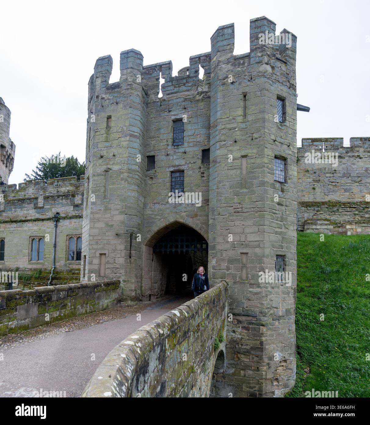 Stone gatehouse entrance at Warwick Castle with an arched passage and ...