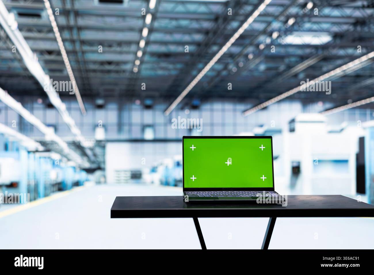 Green screen laptop in empty microchip factory used for testing silicon ...