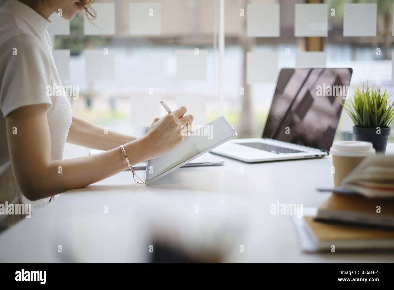 User experience concept. Creative Web Designer sketching application and developing template layout on laptop, framework for digital devices Stock Photo