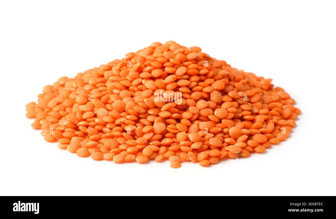 Heap of uncooked red lentils isolated on white Stock Photo