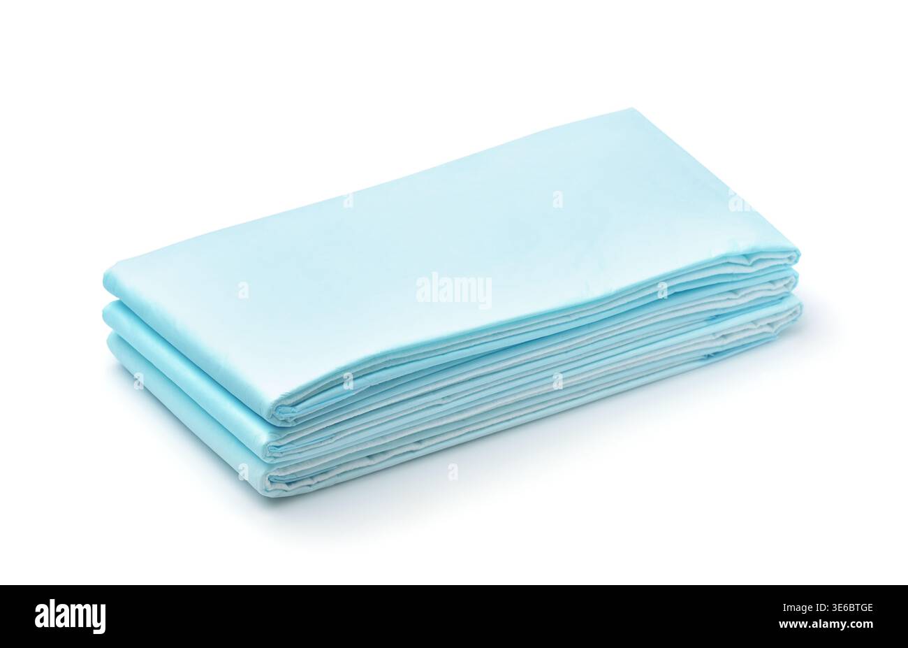 Stack of blue disposable non woven bed sheets isolated on white Stock Photo