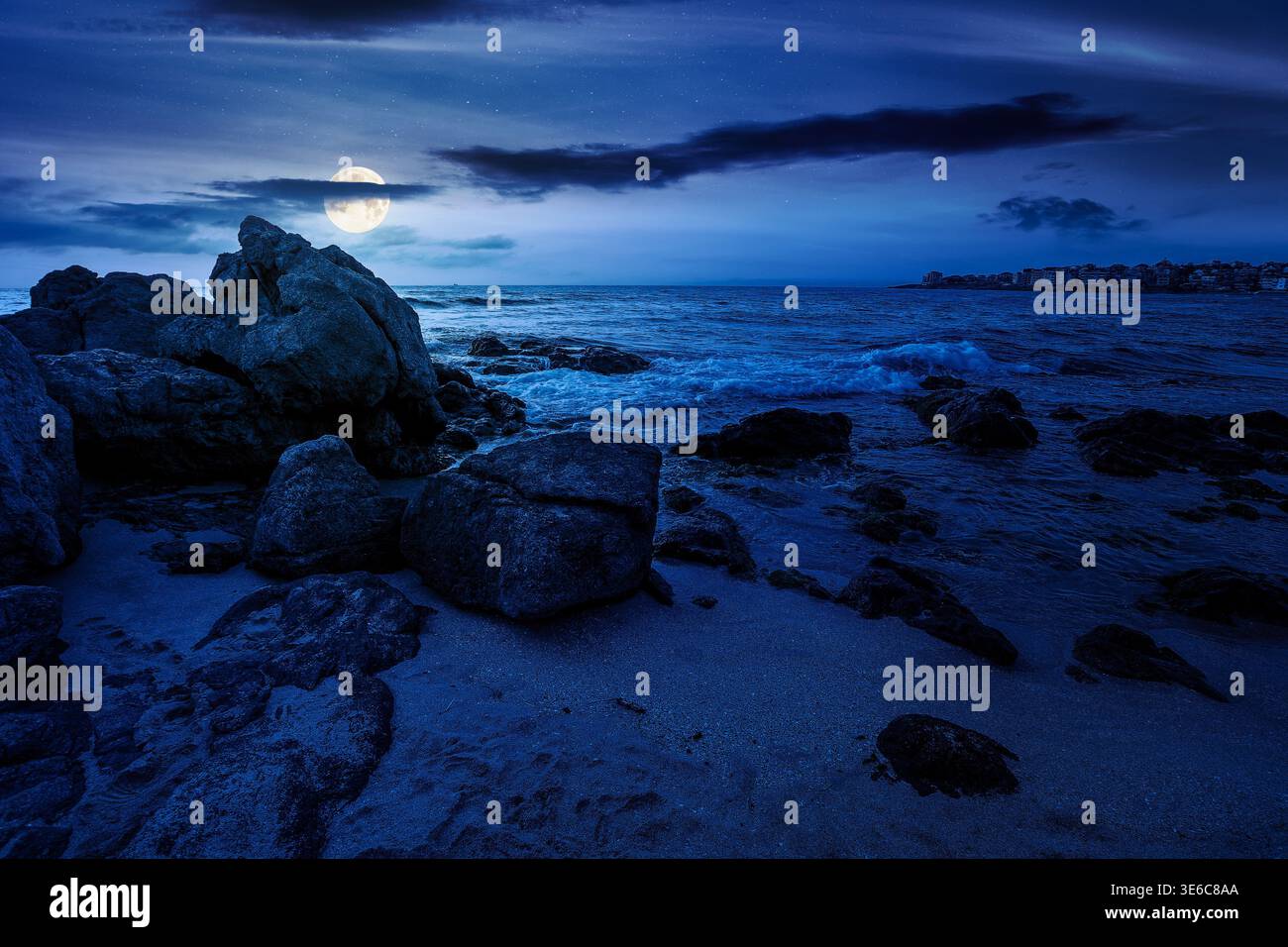 sandy beach landscape at night. full moon over coastal seascape scenery. mysterious nature background for summer vacation at the shore of black sea wi Stock Photo