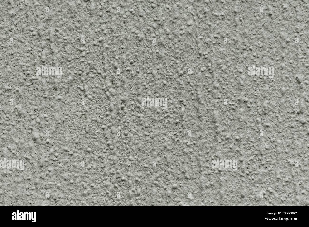 Rough stucco wall texture with grainy surface Stock Photo