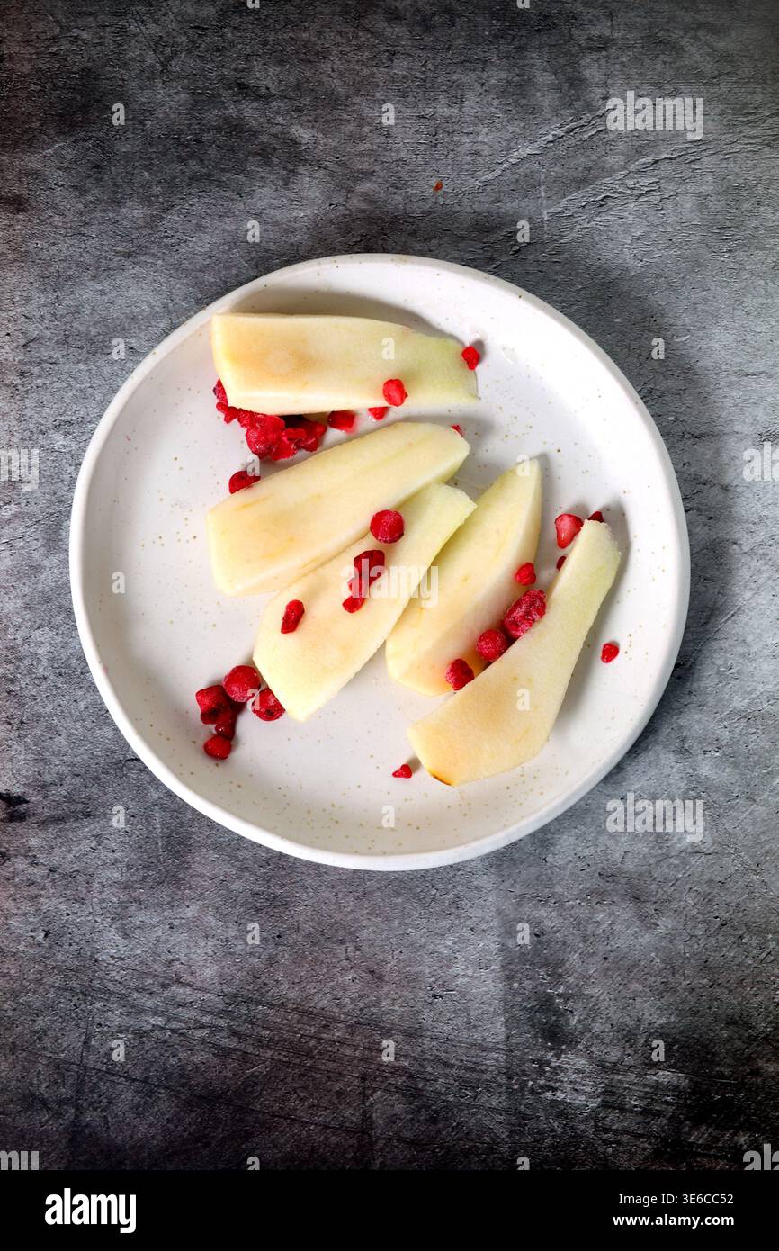 Chopped pear on a plate seen from above Stock Photo