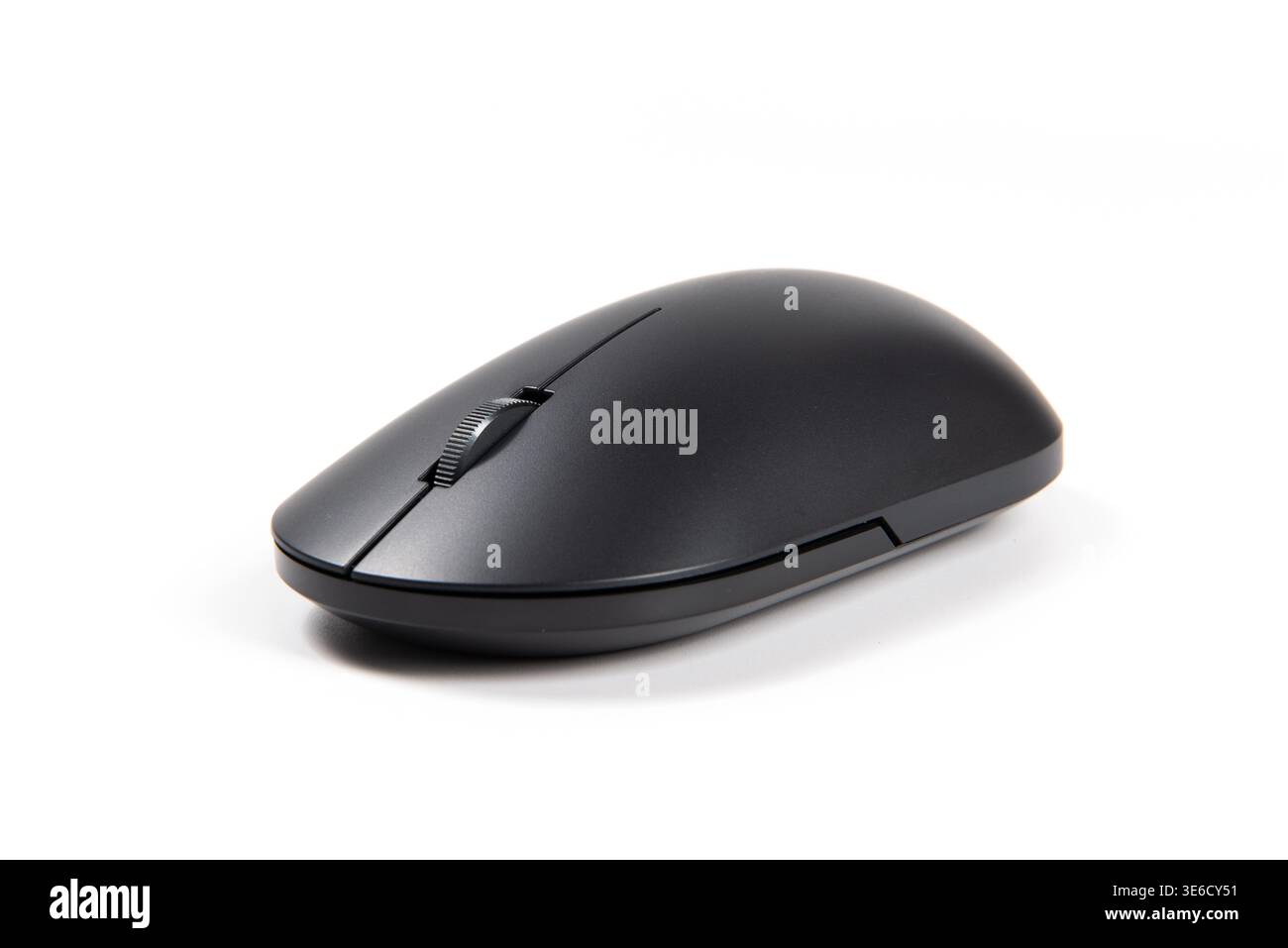 Black wireless computer mouse on white background, showing scroll wheel and modern design Stock Photo