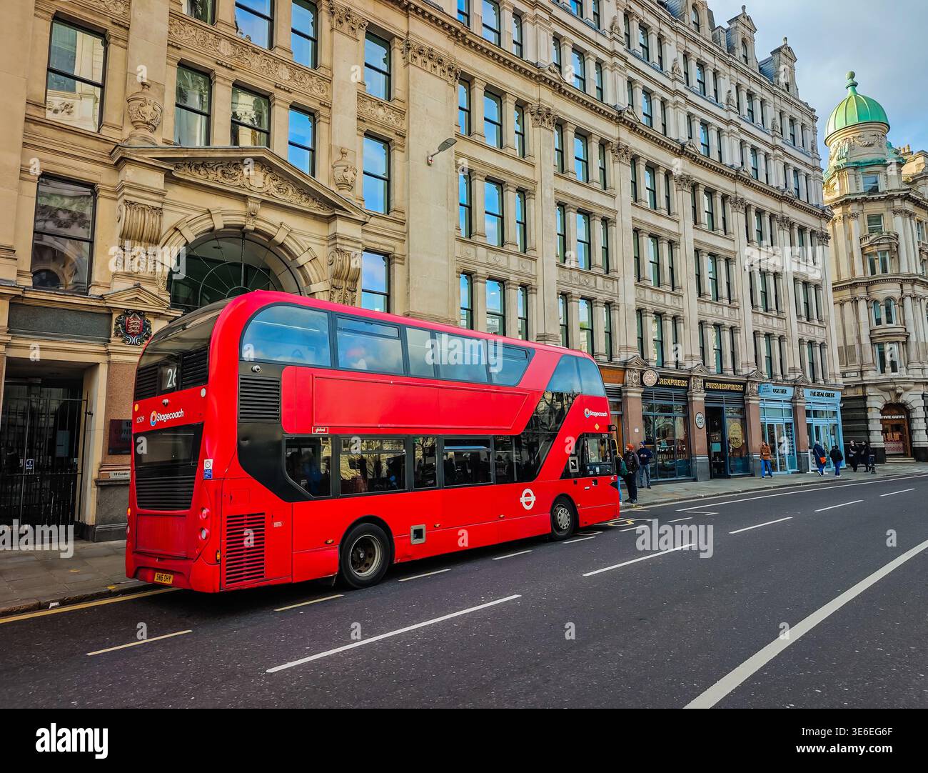 April 6, 2026 - London, UK. Iconic red double decker bus driving ...