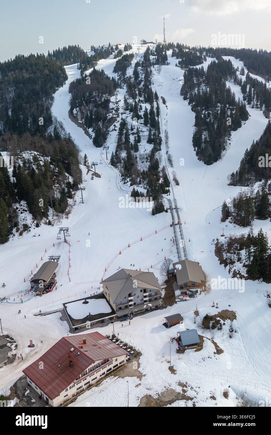 Aerial view of a winter ski resort in the Jura mountains, with snowy ...