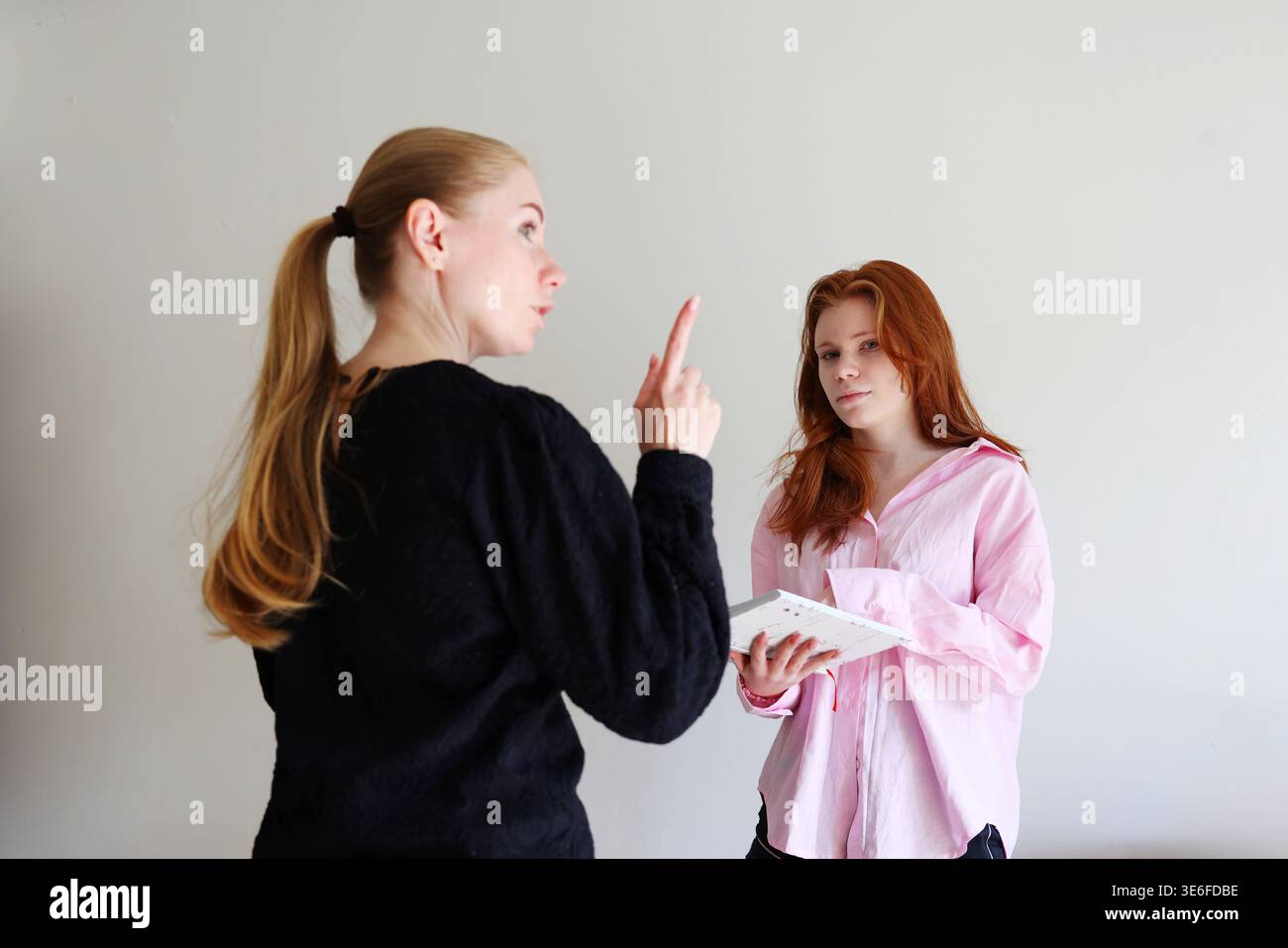 Female students studying together, discussion and learning process concept. Stock Photo