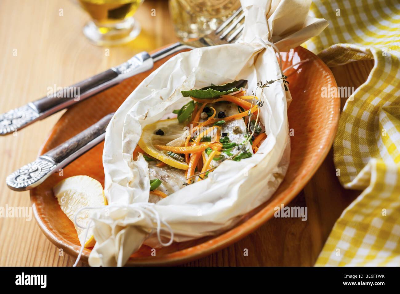 Cod fillets baked in parchment paper Stock Photo