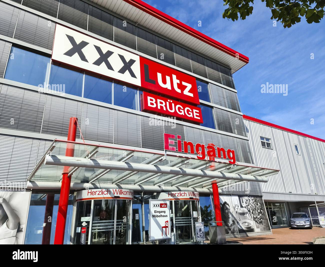 Kiel, Germany - 05. December 2024: The entrance area of a branch of the furniture department stores' XXX Lutz in sunny weather Stock Photo