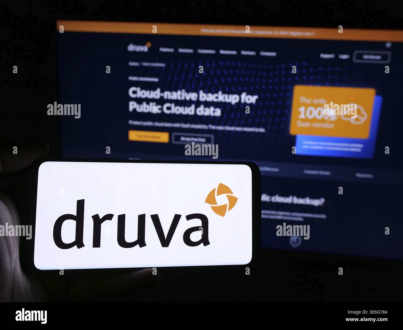 Stuttgart, Germany - 08-24-2024: Person holding smartphone with logo of US data protection software company Druva Inc. in front of website. Focus on p Stock Photo
