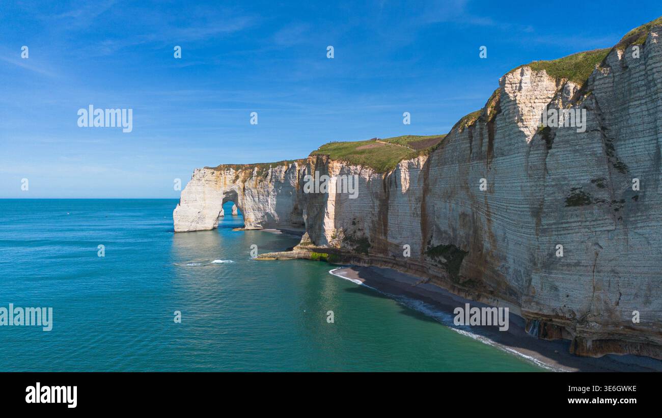 Aerial view of the iconic white cliffs and Manneporte natural arch in ...