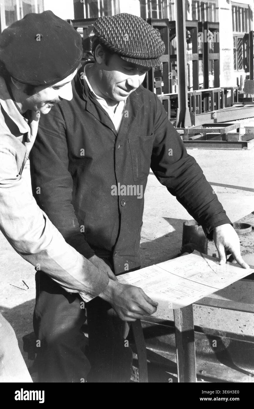 Intellectual Labour Sloviansk, 1980s, AIZ plant yard. Two highly focused male factory ...