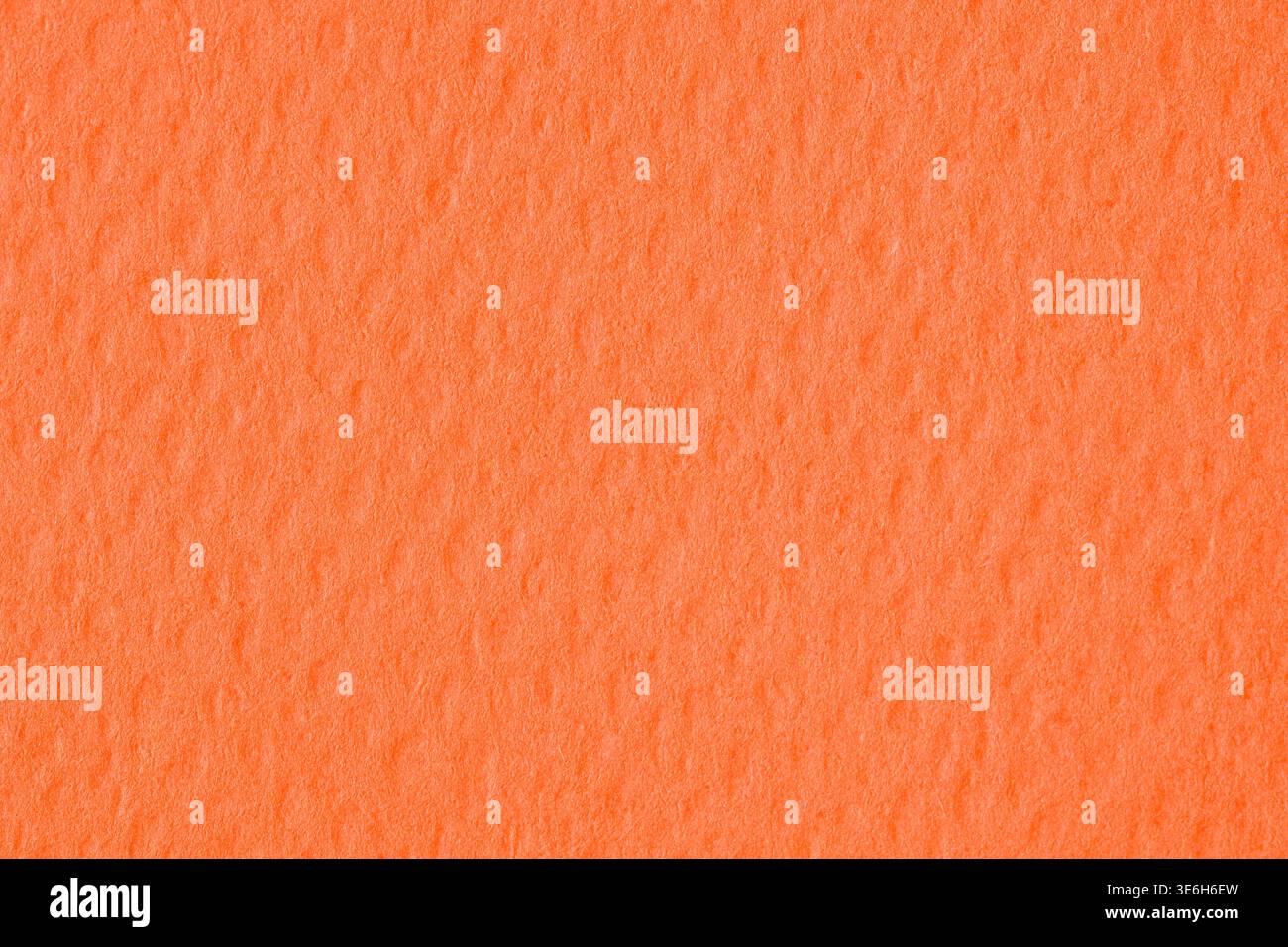 Vibrant orange textured paper background with soft grain pattern Stock Photo