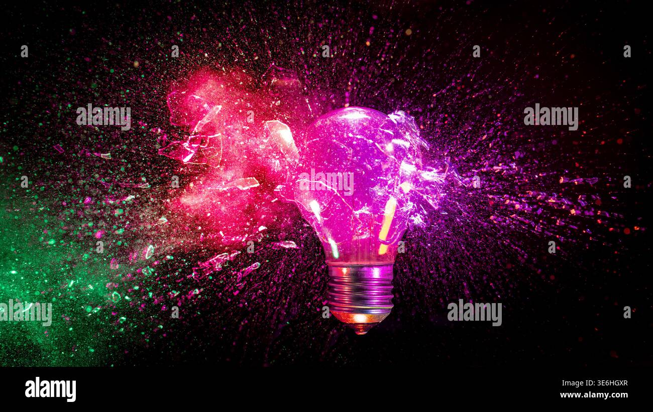 Real Light bulb exploding black background Stock Photo