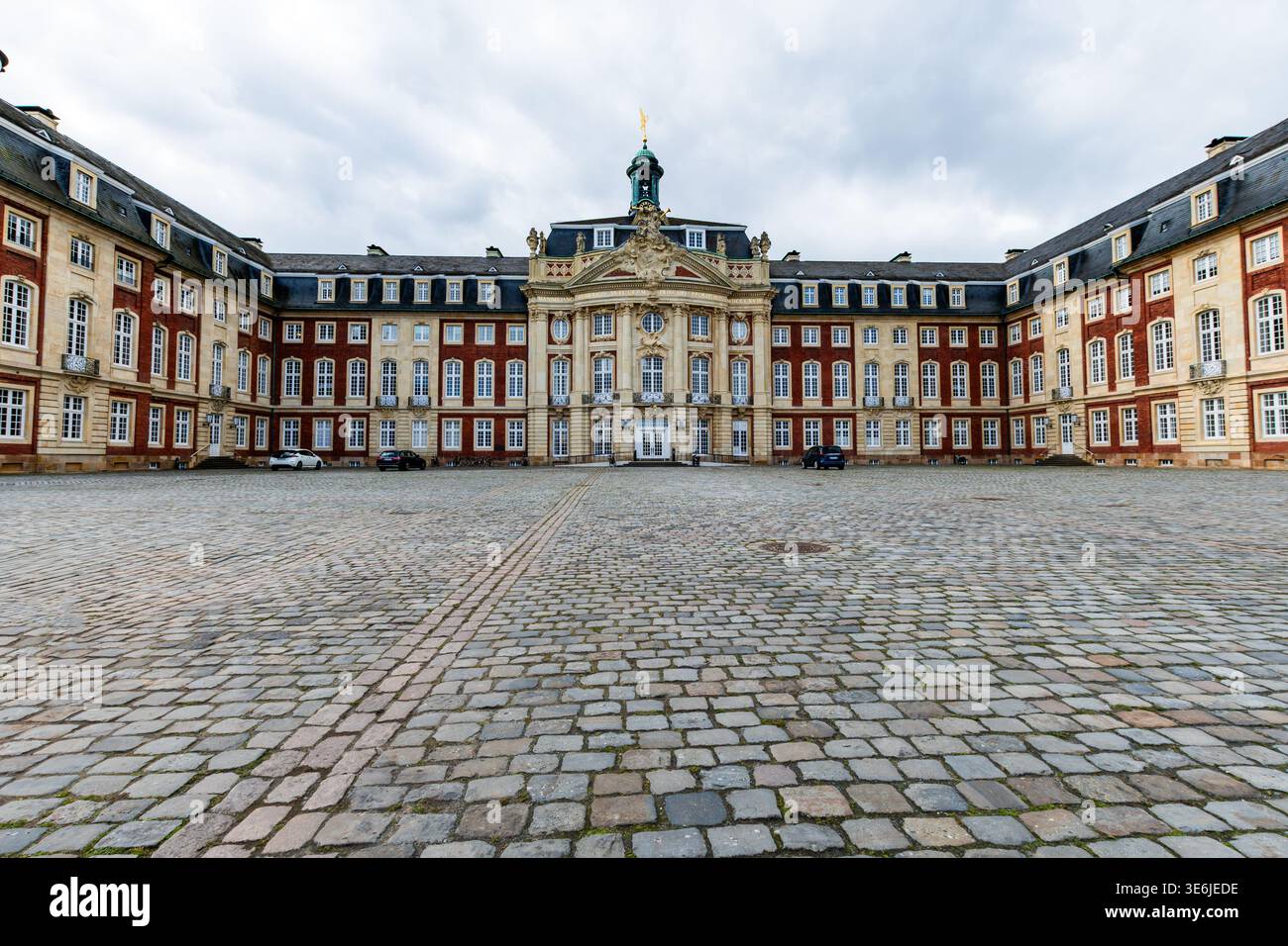 Münster, North Rhine-Westphalia, Germany, 31 March 2026: Frontal view of the historic Münster Castle (Schloss Münster) with its symmetrical baroque fa Stock Photo