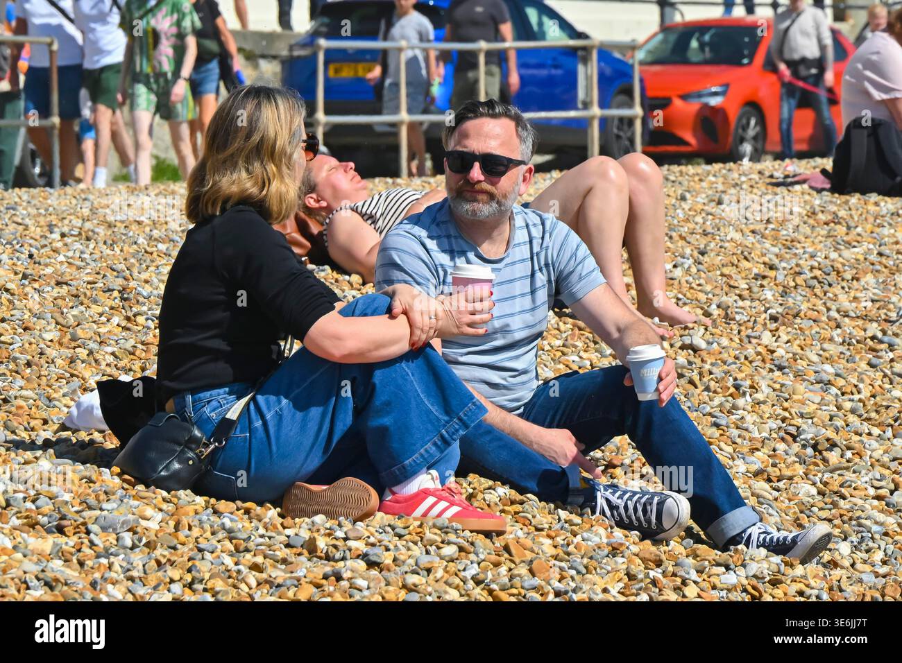 Lyme Regis, Dorset, UK. 7th April 2026. UK Weather. Sunbathers on the ...