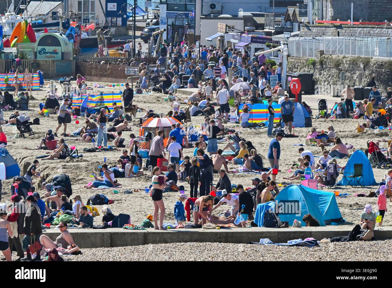 Lyme Regis, Dorset, UK. 7th April 2026. UK Weather. The beach is packed ...