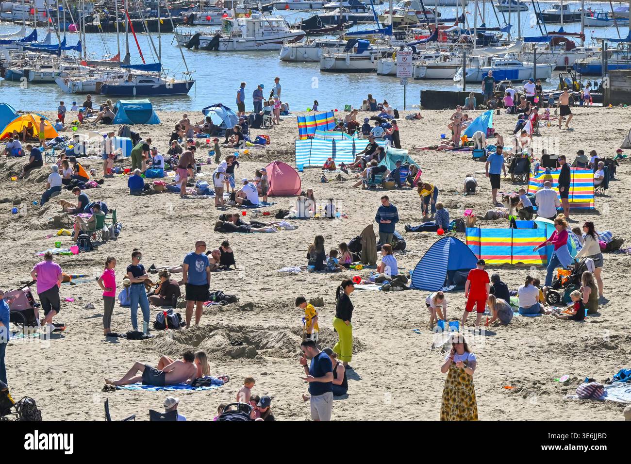 Lyme Regis, Dorset, UK. 7th April 2026. UK Weather. The beach is packed ...