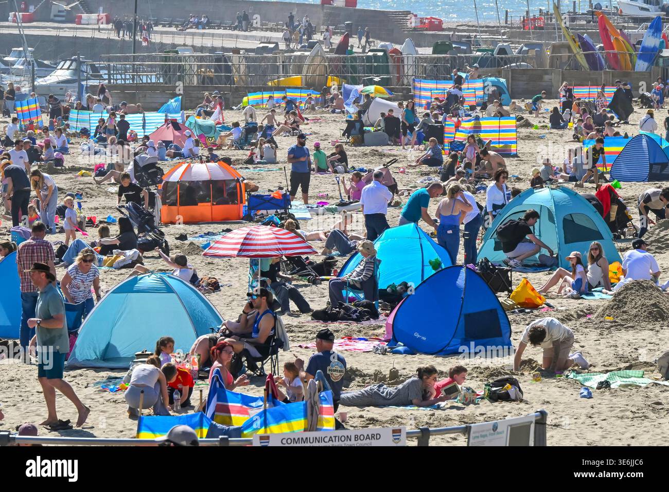 Lyme Regis, Dorset, UK. 7th April 2026. UK Weather. The beach is packed ...