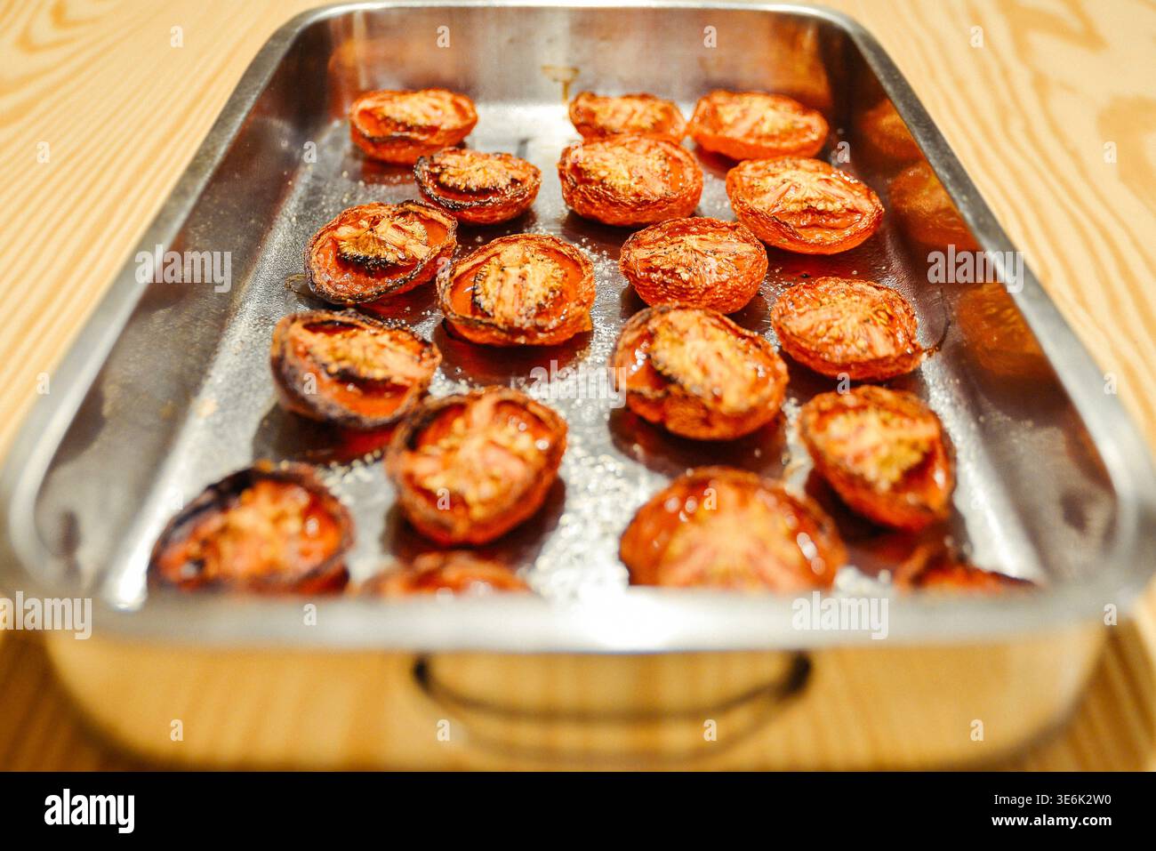 Oven Roasted Cherry Tomatoes In A Baking Tray Stock Photo