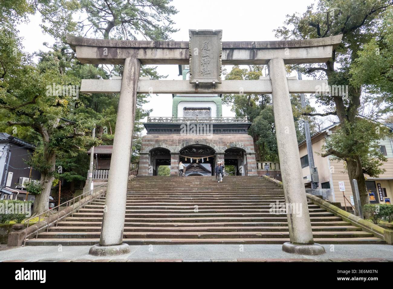 The stone torii gate and staircase leading to Oyama Shrine are seen in ...
