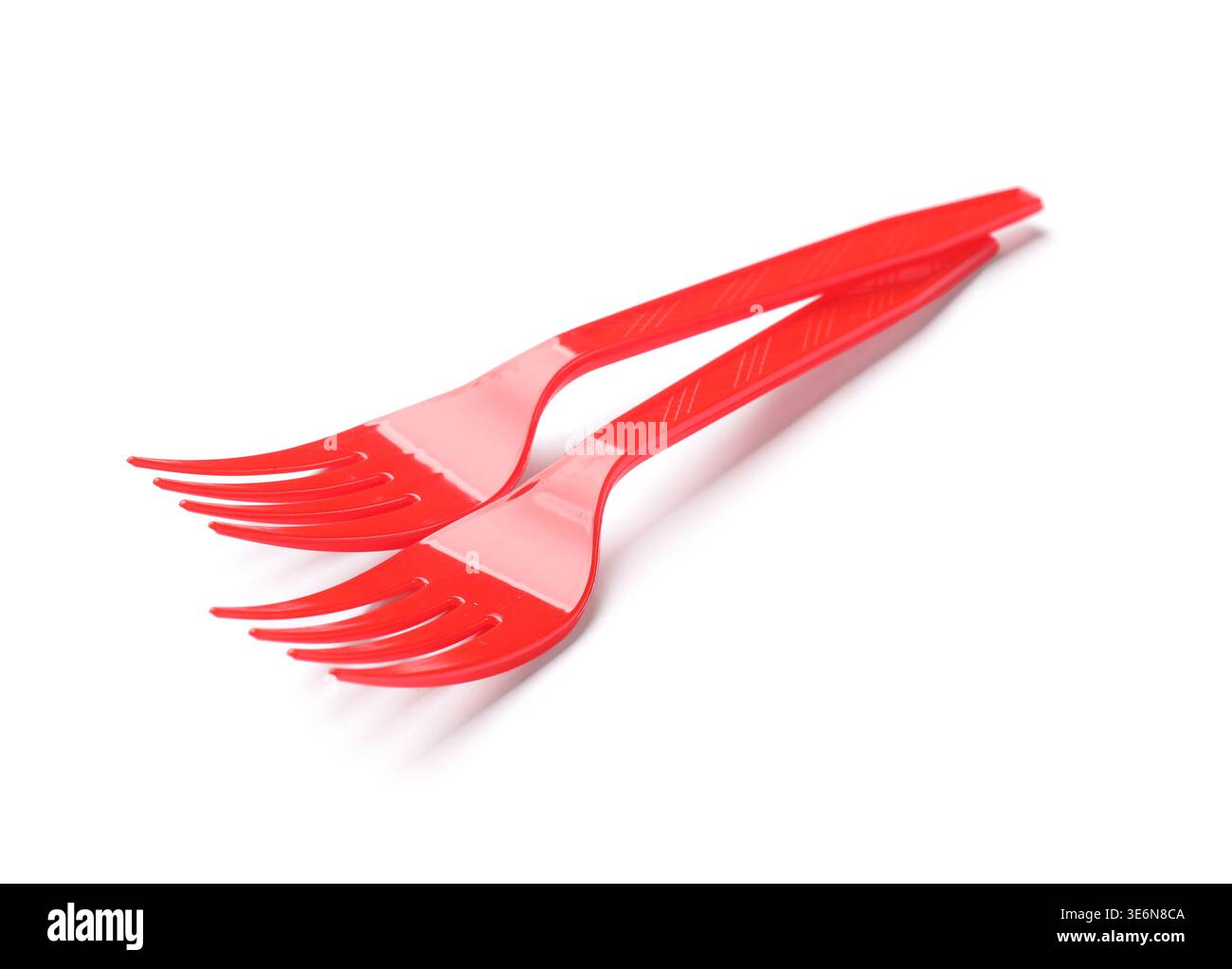 Two red plastic forks isolated on white Stock Photo
