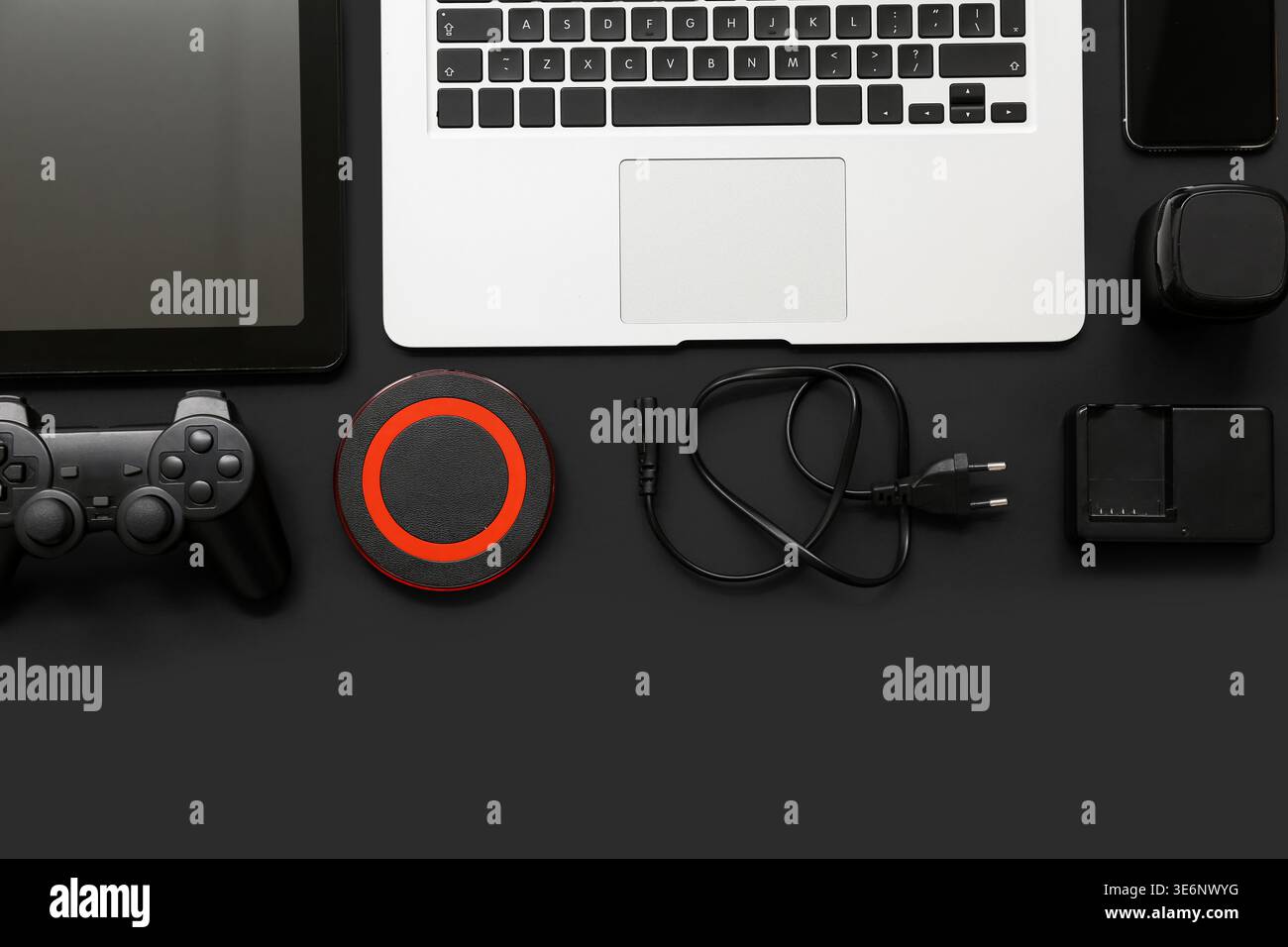 Composition with different modern gadgets on dark background Stock Photo
