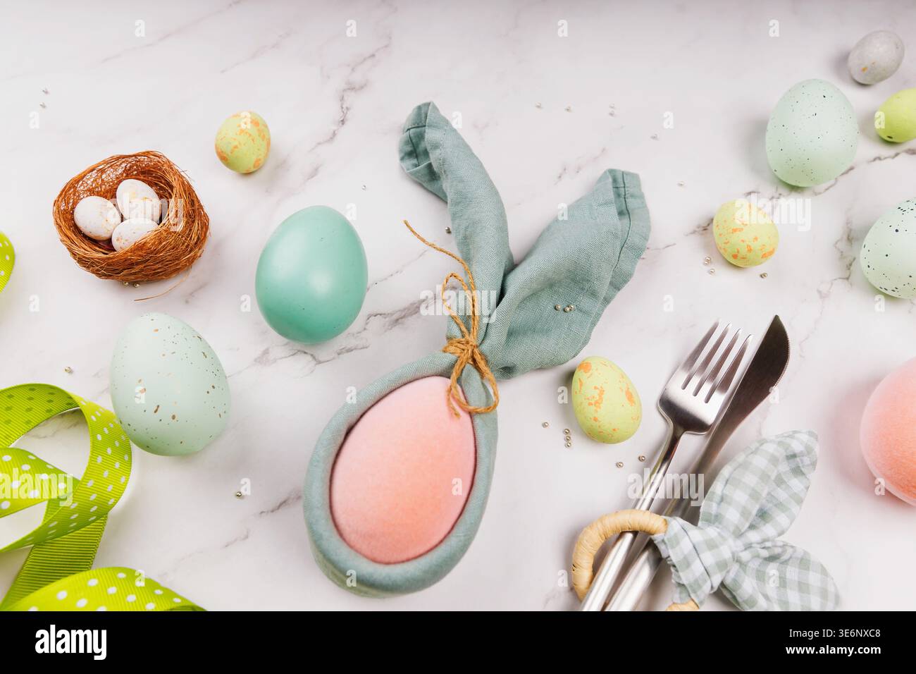 Creative Easter Composition with Decorated Eggs and Bunny Napkin Stock Photo