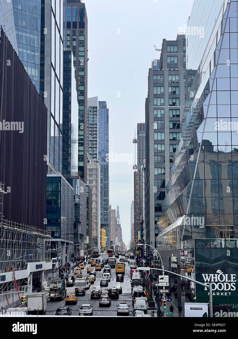 Busy avenue lined with modern high-rise buildings in Hudson Yards, Manhattan, New York City, USA. - Smartphone Captured Stock Image