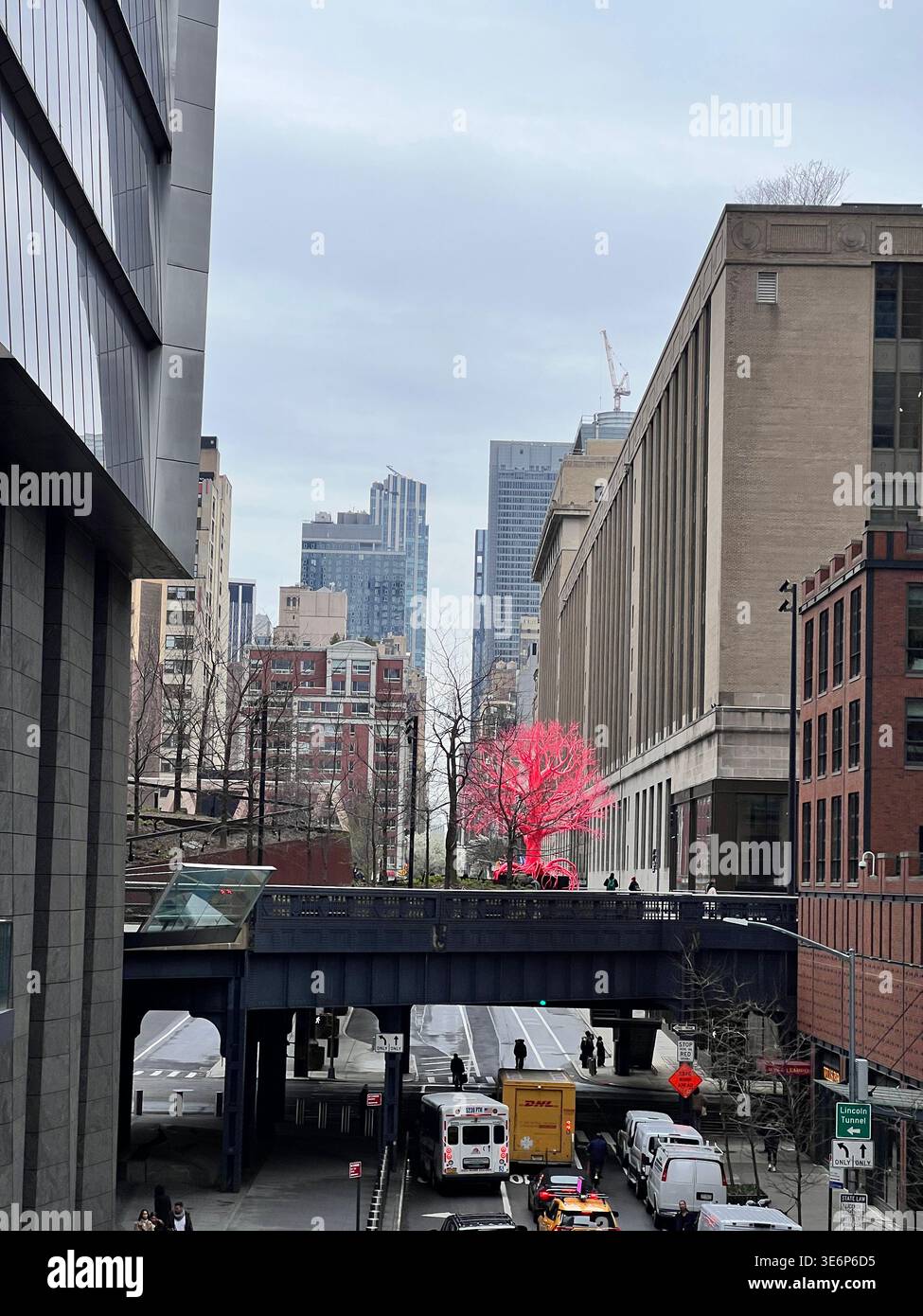 Street view toward a red tree sculpture in Hudson Yards, Manhattan, New York City, USA. - Smartphone Captured Stock Image